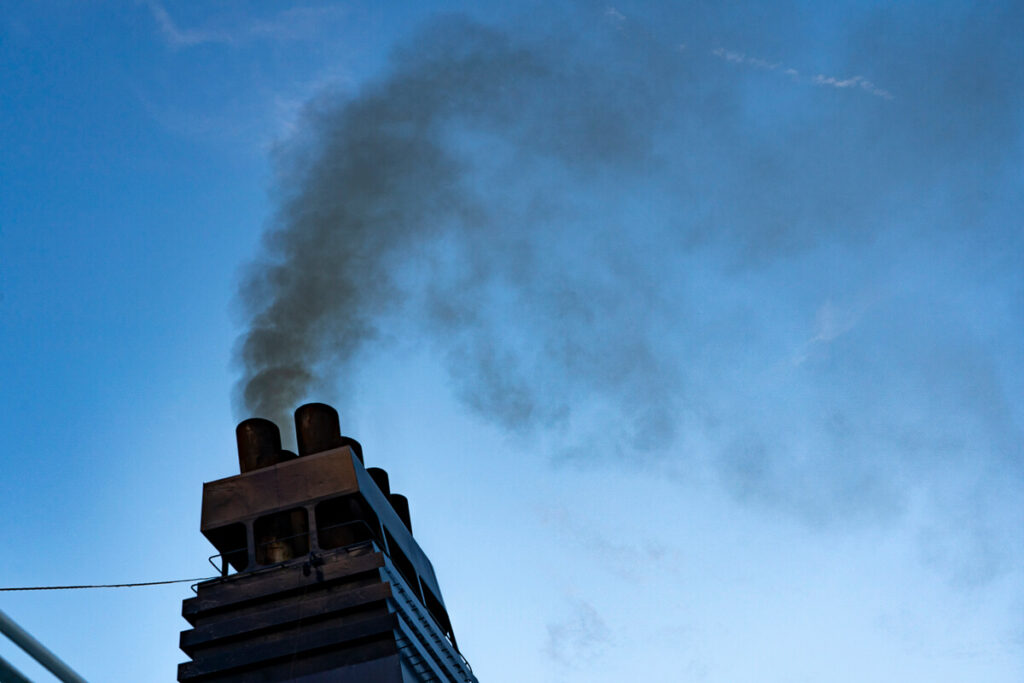 Black smoke including black carbon particulate matter coming from the funnel of a ship. Copyright Dave Walsh 2024, not for reuse or redistribution.